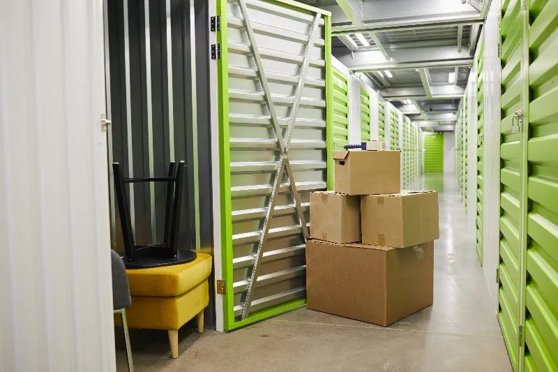 Boxes waiting at an open storage unit door